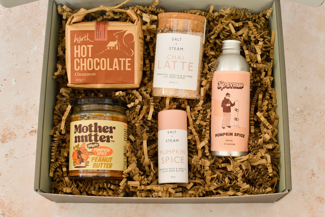 Pumpkin Spice And All Things Nice autumn gift box with pumpkin spice syrup, peanut butter, body butter, chai body scrub and cinnamon hot chocolate